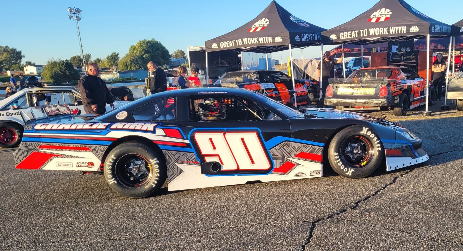 Number 90 full-size race car and custom trackside canopies by Studio 10 Wraps